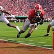 Georgia running back Trevor Etienne (1) is forced out of bounds by Auburn's Keyron Crawford (24) short of the end zone after making a catch in the first half of an NCAA college football game Saturday, Oct. 5, 2024, in Athens, Ga. (AP Photo/John Bazemore)