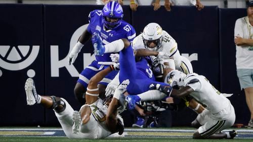 Georgia Tech Yellow Jackets defenders, including linebacker Kyle Efford (44), stop Georgia State Panthers running back Sy'veon Wilkerson (3) during a first-half goal-line stand in an NCAA football game between Georgia State and Georgia Tech at Bobby Dodd Stadium in Atlanta on Saturday, Aug. 31, 2024. (Bob Andres for The Atlanta Journal-Constitution)