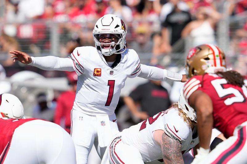 Arizona Cardinals quarterback Kyler Murray (1) gestures behind center at the line of scrimmage during the first half of an NFL football game against the San Francisco 49ers in Santa Clara, Calif., Sunday, Oct. 6, 2024. (AP Photo/Godofredo A. Vásquez)