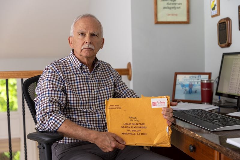 David Hoort, a former Michigan judge, is the new attorney assigned to Leslie Singleton's case and is shown here at his Mableton office holding case file documents. So far, he has found his task daunting. "It’s almost difficult to present our case, if not almost impossible," Hoort said. (Arvin Temkar/arvin.temkar@ajc.com)