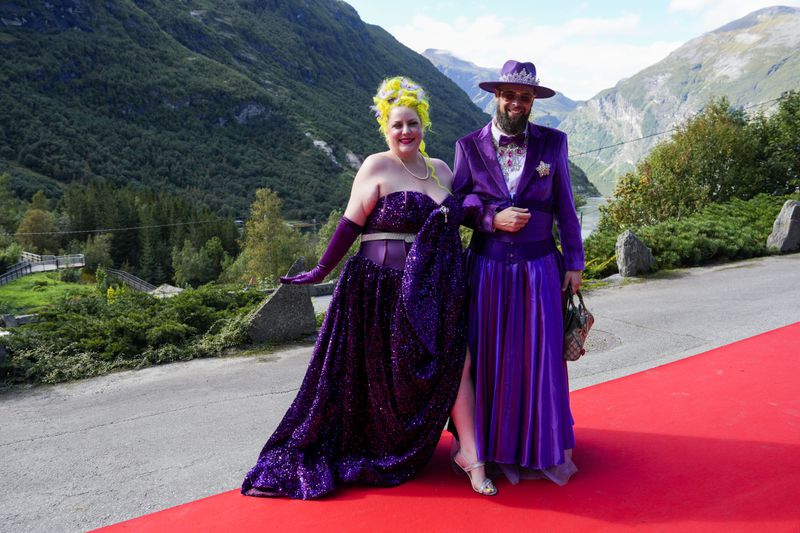 Margie Plus and Harald Austad attend the wedding of Norway's Princess Martha Louise and Durek Verrett, in Geiranger, Norway, Saturday Aug. 31, 2024. (Cornelius Poppe/NTB via AP)