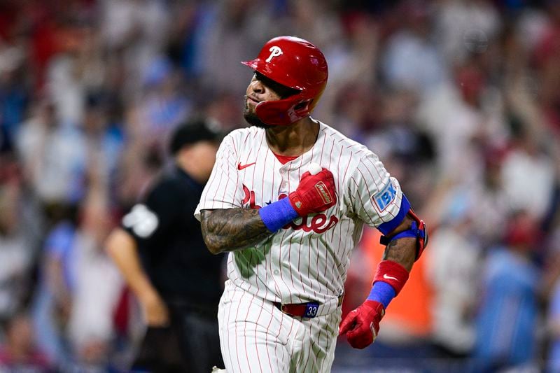 Philadelphia Phillies' Edmundo Sosa reacts after hitting a solo home run off Atlanta Braves' Max Fried during the third inning of a baseball game, Saturday, Aug. 31, 2024, in Philadelphia. (AP Photo/Derik Hamilton)