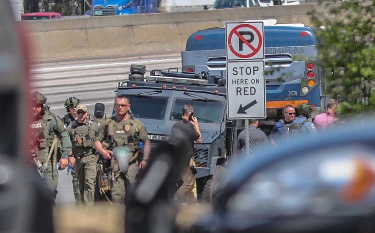 I-85 shut down as Gwinnett SWAT surrounds bus with armed man aboard