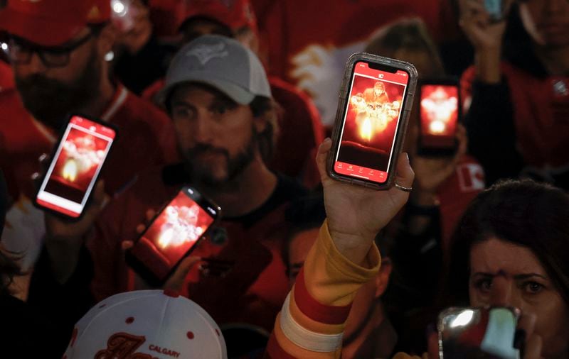 Fans attend a vigil for former Calgary Flames player Johnny Gaudreau and his brother Matthew in Calgary, Alberta., Wednesday, Sept. 4, 2024. (Jeff McIntosh/The Canadian Press via AP)