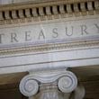 FILE- This photo shows the U.S. Treasury Department building at dusk in Washington, June 6, 2019. (AP Photo/Patrick Semansky, File)