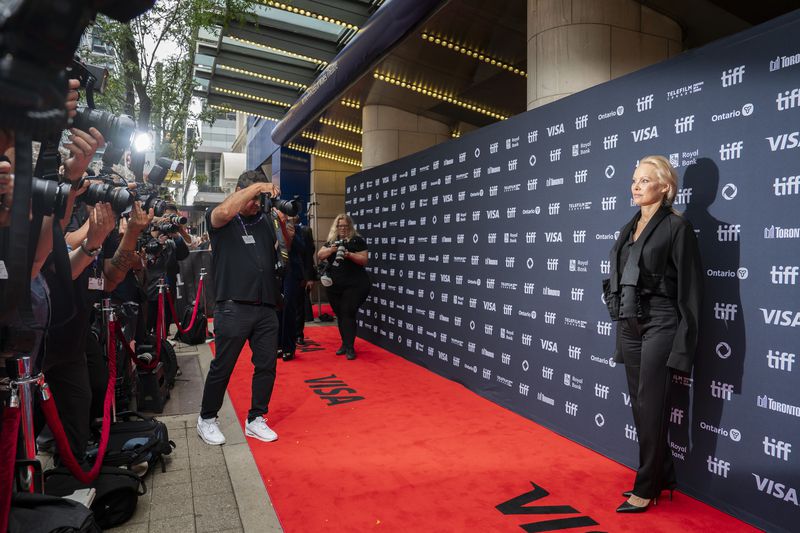 Pamela Anderson stands on the red carpet for the premiere of "The Last Showgirl" at the Princess of Wales Theatre, during the Toronto International Film Festival, in Toronto, Friday Sept. 6, 2024. (Paige Taylor White/The Canadian Press via AP)