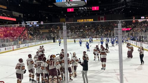 FILE - Arizona State players celebrate after beating Alaska Anchorage in an NCAA college hockey game on Friday, Feb. 9, 2024, at Mullett Arena in Tempe, Arizona. (AP Photo/Stephen Whyno)