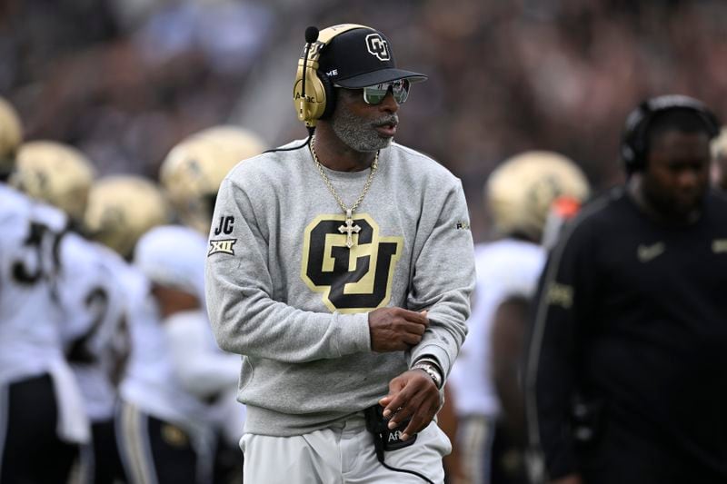 Colorado head coach Deion Sanders walks along the sideline during the first half of an NCAA college football game against Central Florida, Saturday, Sept. 28, 2024, in Orlando, Fla. (AP Photo/Phelan M. Ebenhack)