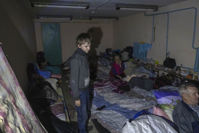 Local residents hide in a basement in Sudzha, Kursk region, Russia, Friday, Aug. 16, 2024. This image was approved by the Ukrainian Defense Ministry before publication. (AP Photo)