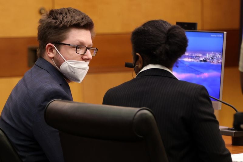 Robert Aaron Long speaks with defense attorney Jerilyn Bell during a hearing Tuesday in Fulton County. 