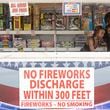 Rynni, left, and Elijah, right, prep fireworks for customers for Independence Day 2023 at a TNT Fireworks booth in Snellville. (Michael Blackshire/Michael.blackshire@ajc.com)