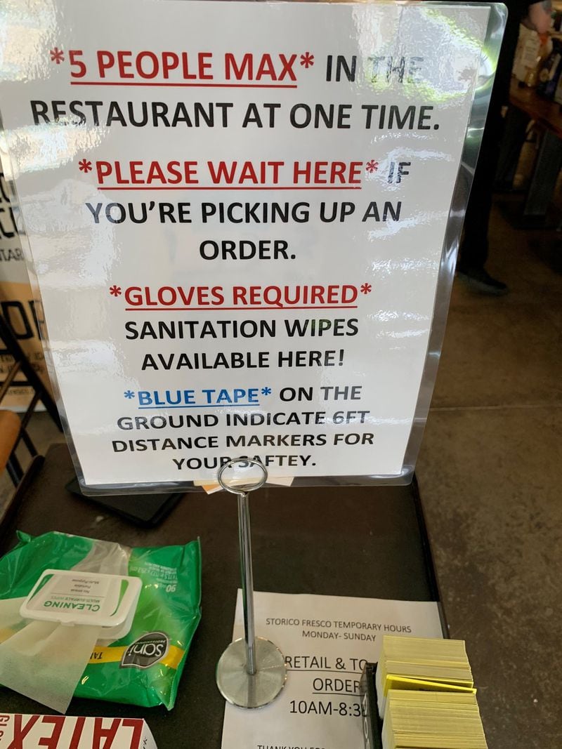 A sign at the entry to Storico Fresco in Buckhead informs shoppers of the store’s safety measures during the coronavirus crisis. CONTRIBUTED BY STORICO FRESCO