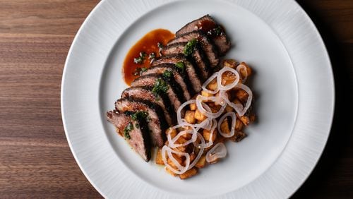 The short rib from Austin's at Serenbe comes brushed in fermented honey and served with crushed herbs, potatoes, chilis, garlic and pickled shallots. / Courtesy of Erik Meadows Photography