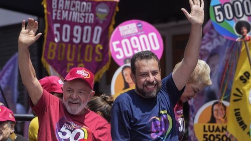 Brazilian President Luiz Inacio Lula da Silva, left, campaigns with mayoral candidate Guilherme Boulos of the Socialism and Liberty Party the day before elections in Sao Paulo, Saturday, Oct. 5, 2024. (AP Photo/Andre Penner)