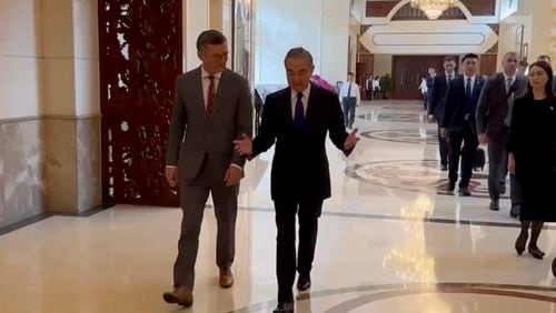 In this image taken from video released by the Ukraine Ministry of Foreign Affairs, Ukraine's Foreign Ministry Dmytro Kuleba, left walks with China's Foreign Minister Wang Yi before a meeting in the southern Chinese city of Guangzhou on Wednesday, July 24, 2024. Ukraine's foreign minister says he is seeking "common ground" in talks with his Chinese counterpart on ending his country's war with Russia. It is the first visit by a Ukrainian foreign minister since the war started in 2022. (Ukraine's Ministry of Foreign Affairs via AP)