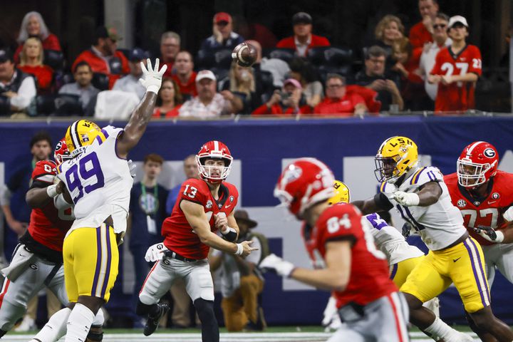 Georgia Bulldogs quarterback Stetson Bennett (13) throws downfield against the LSU Tigers during the second half of the SEC Championship Game at Mercedes-Benz Stadium in Atlanta on Saturday, Dec. 3, 2022. (Bob Andres / Bob Andres for the Atlanta Constitution)