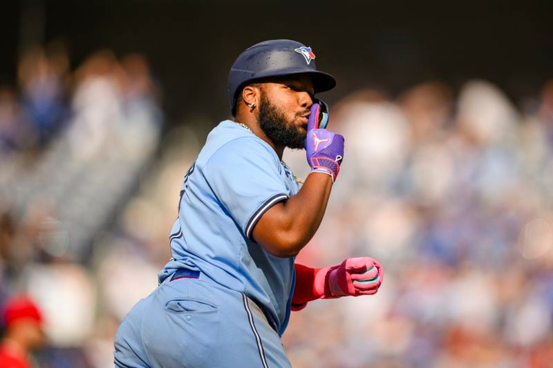 Toronto Blue Jays' Vladimir Guerrero Jr. celebrates after hitting a home run during eighth-inning baseball game action against the Los Angeles Angels in Toronto, Saturday, Aug. 24, 2024. (Christopher Katsarov/The Canadian Press via AP)