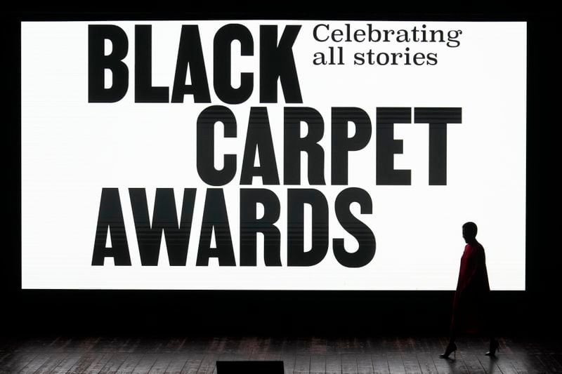 Host Tamu McPherson walks on the stage during the second edition of the 'Black carpet awards' in Milan, Italy, Friday, Sept. 20, 2024. (AP Photo/Luca Bruno).