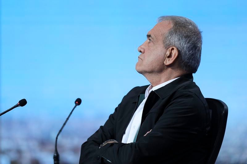 In this picture made available by Iranian state-run TV, IRIB, presidential candidate for the June 28 election Masoud Pezeshkian, who is a lawmaker, attends a debate of the candidates at the TV studio in Tehran, Iran, Tuesday, June 25, 2024. (Morteza Fakhri Nezhad/IRIB via AP)