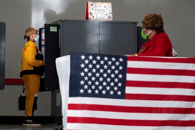 FILE - A voter marks her ballot during the first day of early voting in Atlanta, Oct. 17, 2022. (AP Photo/Ben Gray, File)