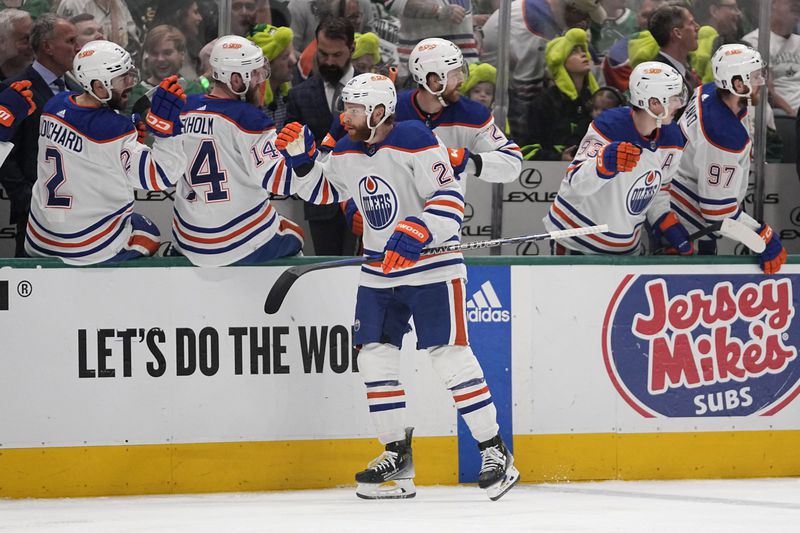 Edmonton Oilers right wing Connor Brown is congratulated for his goal against the Dallas Stars during the first period in Game 2 of the Western Conference finals in the NHL hockey Stanley Cup playoffs Saturday, May 25, 2024, in Dallas. (AP Photo/Tony Gutierrez)
