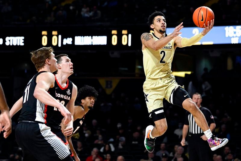 Vanderbilt guard Scotty Pippen Jr. (2) drives to the basket past Georgia defenders during the first half of an NCAA college basketball game against Saturday, Jan. 29, 2022, in Nashville, Tenn. (AP Photo/Mark Zaleski)