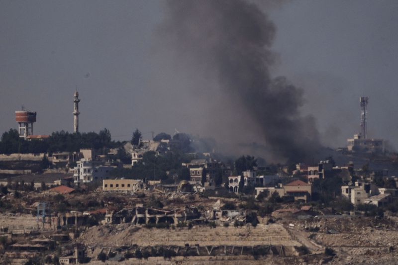 Smoke rises from a fire in southern Lebanon as seen from northern Israel, Saturday, Oct. 5, 2024. (AP Photo/Leo Correa)