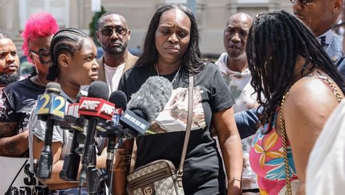 Tabatha Colzie, the mother of one of the victims in a shooting in Mechanicsville, speaks Friday outside Grady Memorial Hospital.