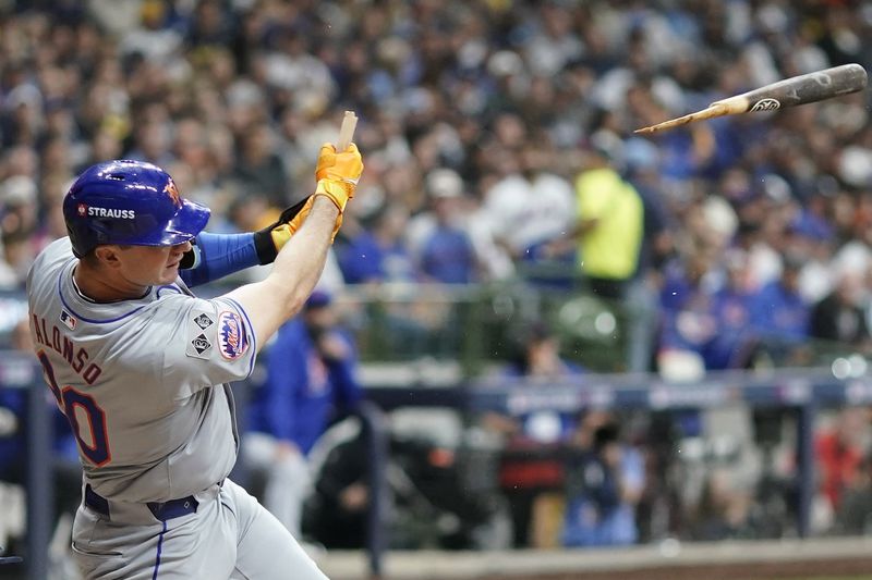 New York Mets' Pete Alonso hits a broken-bat single during the seventh inning of Game 2 of a National League wild card baseball game against the Milwaukee Brewers Wednesday, Oct. 2, 2024, in Milwaukee. (AP Photo/Morry Gash)