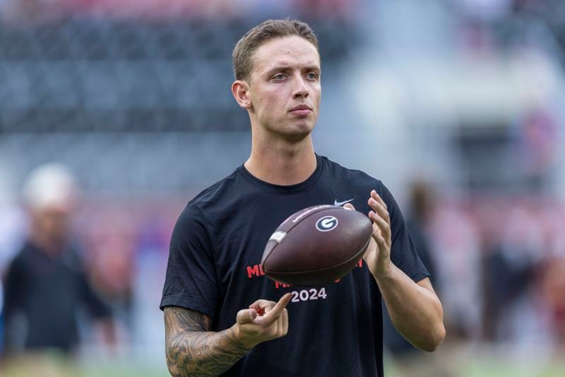 Georgia quarterback Carson Beck (15) takes the field for early warm-ups before an NCAA college football game against Alabama, Saturday, Sept. 28, 2024, in Tuscaloosa, Ala. (AP Photo/Vasha Hunt)