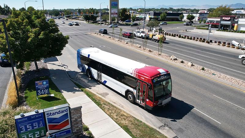 A commuter bus equipped with a radio transmitter passes a connected traffic light on Redwood Road, part of an effort to improve safety and efficiency by allowing cars to communicate with the roadside infrastructure and one another, Friday, Sept. 6, 2024, near Taylorsville, Utah. (AP Photo/Rick Bowmer)