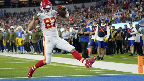 FILE - Kansas City Chiefs tight end Travis Kelce runs in for a touchdown during the first half of an NFL football game against the Los Angeles Chargers Sunday, Nov. 20, 2022, in Inglewood, Calif. (AP Photo/Jae C. Hong, File)