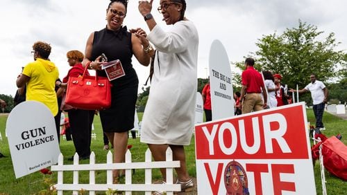 Delta Sigma Theta Stone Mountain-Lithonia Alumnae Chapter president Candace Hull-Simon, left, speaks with member Latise Egeston after a voter mobilization event at New Birth Missionary Baptist Church in Stonecrest, GA on Saturday, July 20, 2024. (Seeger Gray / AJC)