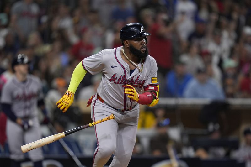 Atlanta Braves' Marcell Ozuna watches his home run during the ninth inning of a baseball game against the San Diego Padres, Friday, July 12, 2024, in San Diego. (AP Photo/Gregory Bull)