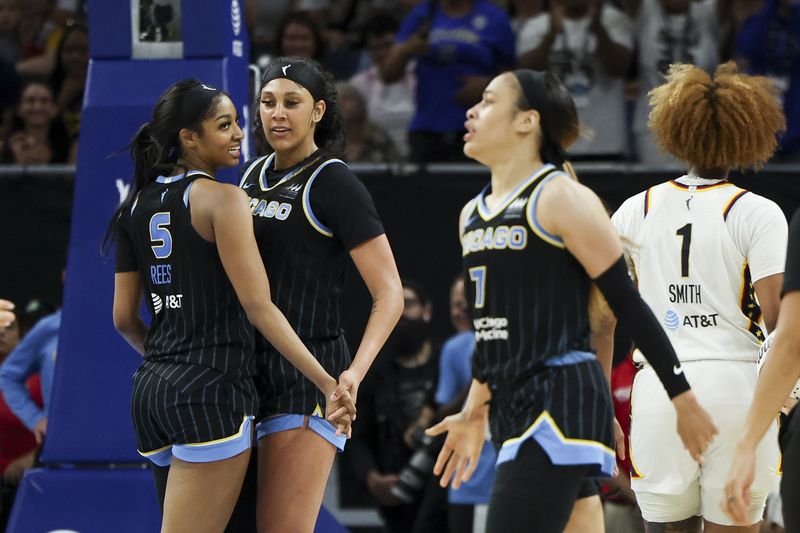 Chicago Sky forward Angel Reese (5) and center Kamilla Cardoso (10) celebrate a foul on the Indiana Fever during a WNBA basketball game, Sunday, June 23, 2024, in Chicago. (Eileen T. Meslar/Chicago Tribune via AP)