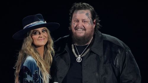 Lainey Wilson, left, and Jelly Roll perform "Save Me" at the 58th annual Academy of Country Music Awards on Thursday, May 11, 2023, at the Ford Center in Frisco, Texas. (AP Photo/Chris Pizzello)