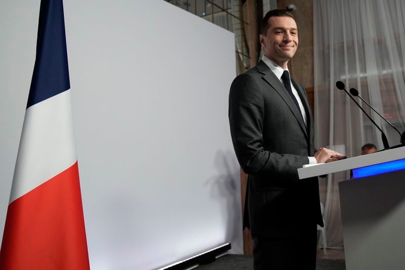 Far-right National Rally party president Jordan Bardella arrives to give a press conference, Monday, June 24, 2024 in Paris. The upcoming two-round parliamentary election will take place on June 30 and July 7. (AP Photo/Christophe Ena)