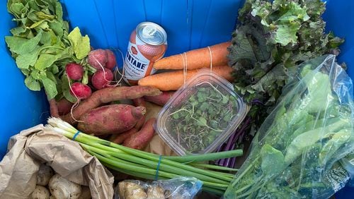 The core of Fresh Harvest's subscription-based weekly food delivery service is a customizable basket featuring locally grown, certified organic produce. Ligaya Figueras/ligaya.figueras@ajc.com