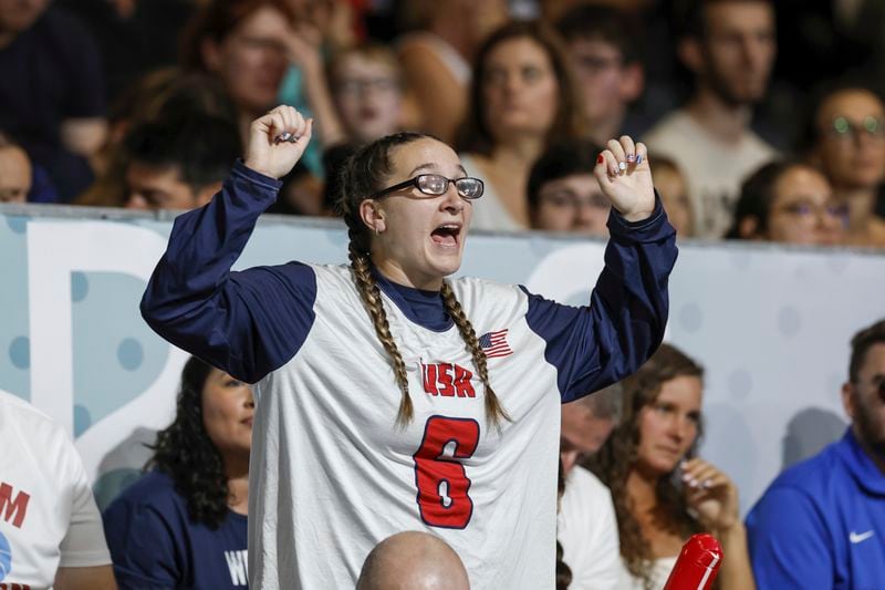 Eliana Mason, fiancé of American goalball team captain Callahan Young, cheers during the mens' United States versus France goalball game during the Paralympic Games in Paris, Saturday, Aug. 31, 2024. (AP Photo/Felix Scheyer)