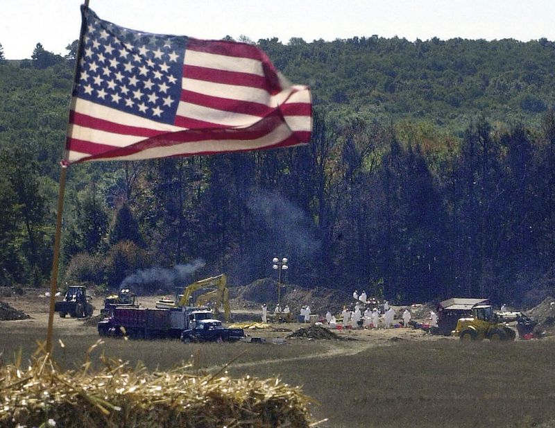 FILE - A makeshift altar, constructed for a worship service, overlooks the the crash site of United Airlines Flight 93, Sept. 16, 2001, in Shanksville, Pa. (AP Photo/Gene J. Puskar, File)