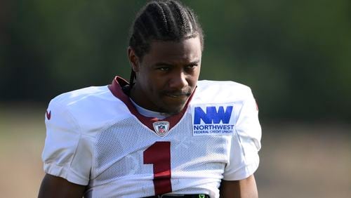 FILE - Washington Commanders wide receiver Jahan Dotson (1) works out during NFL football training camp, Monday, July 29, 2024, in Ashburn, Va. (AP Photo/Nick Wass, File)