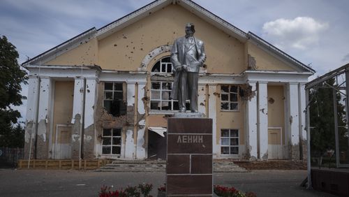 A damaged monument to Soviet founder Vladimir Lenin stands in a central square in Sudzha, Kursk region, Russia, Friday, Aug. 16, 2024. This image was approved by the Ukrainian Defense Ministry before publication. (AP Photo)