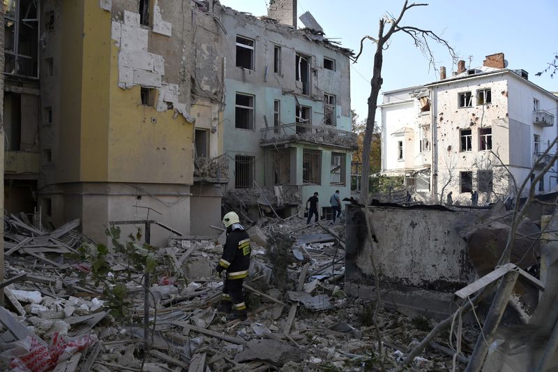 FILE - Rescuers search for victims in an apartment building destroyed by Russian missile attack in centre Lviv, Western Ukraine, Sept. 4, 2024. (AP Photo/Mykola Tys, File)