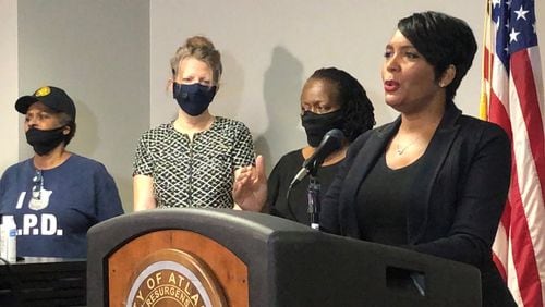 Atlanta Mayor Keisha Lance Bottoms, right, speaks during a press conference at Atlanta police headquarters about the Saturday night shooting death of 8-year-old Secoriea Turner. J. SCOTT TRUBEY/SCOTTl.TRUBEY@AJC.COM