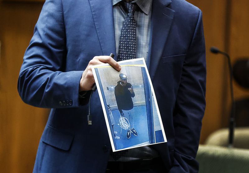 Paul Hagerman, Shelby County Deputy District Attorney, shows the jury a photo of defendant Justin Johnson during the murder trial of rapper Young Dolph in Memphis, Tenn., Monday, Sept. 23, 2024. (Mark Weber/Daily Memphian via AP)