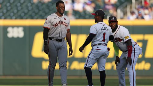 San Francisco Giants designated hitter Jorge Soler, a former Braves player, talks with second baseman Ozzie Albies (1) and designated hitter Marcell Ozuna (20) before their game at Truist Park, Tuesday, July 2, 2024, in Atlanta. (Jason Getz / AJC)