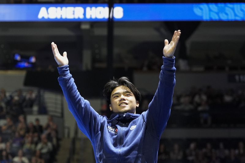 Asher Hong is introduced at the United States Gymnastics Olympic Trials on Saturday, June 29, 2024, in Minneapolis. (AP Photo/Charlie Riedel)