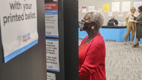 May 2, 2022 Atlanta: Josephine Reed-Taylor casts her ballot as did other voters that gathered at the Buckhead Library located at 269 Buckhead Ave NE in Atlanta for early voting on Monday May 2, 2022. Three weeks of early voting began Monday for voters who want to cast their ballots in the Georgia primary before election day on May 24. In-person early voting is usually the most popular way of participating in Georgia elections, providing at least 17 days when voters can pick a time that fits their schedule. About 54% of voters cast ballots in advance during the 2020 presidential election. The primary includes races for Georgia governor, the U.S. Senate, statewide offices and the General Assembly. Early voting locations, hours and sample ballots are available online on the state’s My Voter Page at mvp.sos.ga.gov. The primary might be the first time many voters go to the polls since the General Assembly passed Georgia’s new voting law in March 2021, though some cities held local elections in the fall. Changes to voting laws affect early voting in several ways. The minimum early voting hours are set at 9 a.m. to 5 p.m., and counties can offer up to 12 hours of daily early voting, from 7 a.m. to 7 p.m. In previous elections, early voting times were required “during normal business hours,” but those hours weren’t defined. Early voting will also be offered on two Saturdays, and local election offices have the option of providing voting hours on two Sundays as well. Before the law, one Saturday of early voting was required. Early voting is available from May 2 to May 20. All voters also have the option of casting absentee ballots in advance of election day, but the rules have changed. Under Georgia’s voting law, voters can no longer request an absentee ballot online without signing a paper form, meaning they’ll need access to a printer in most circumstances. A driver’s license or other form of ID is also required. The state’s new absentee ballot request website is securemyabsenteeballot.sos.ga.gov.
The deadline to request an absentee ballot is now 11 days before election day, on May 13 for the primary, and completed ballots must be received at local election offices before polls close. Voters can return absentee ballots through the mail or in drop boxes, but fewer ballot drop boxes are available this year, and there won’t be an option during the final days of the election. Georgia’s voting law prohibits drop boxes from being used except during early voting hours, and they can only be located inside early voting locations. The number of drop boxes in each county is capped at one for every 100,000 active voters or the number of early voting locations, whichever is lower. Every county must install at least one drop box. (John Spink / John.Spink@ajc.com)


