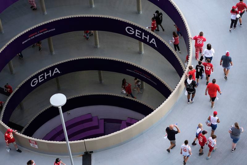 Fans enter Arrowhead Stadium before the start of an NFL football game between the Kansas City Chiefs and the Baltimore Ravens Thursday, Sept. 5, 2024, in Kansas City, Mo. (AP Photo/Charlie Riedel)