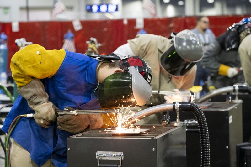 Zander Vaui, from Vermont, uses a cutting torch during a competition at the Skills USA conference at the Georgia World Congress Center in Atlanta on Thursday, June 27, 2024.   (Ben Gray / Ben@BenGray.com)